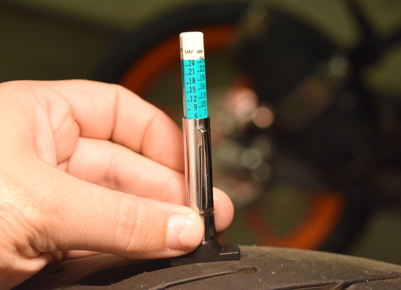 If you are unable to find a wear bar on your tire, you can measure the tread depth with a tread depth gauge or a simple ruler (if it fits).