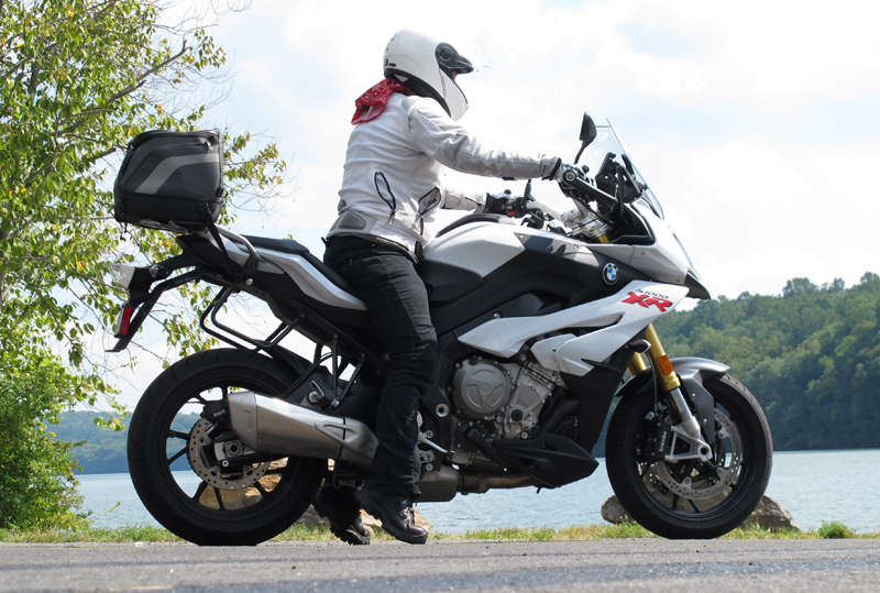 Whether riding a tall sport touring motorcycle like this BMW S 1000 XR (seat height 33.1 inches, same bike I'm on in the above photo), or a cruiser, the same techniques I’ve outlined below apply. This is my friend Laura, who stands 5 feet 4 inches.