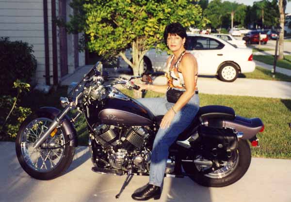 Gina with her Yamaha V Star 650 Custom, the motorcycle that helped her realize her dream. 