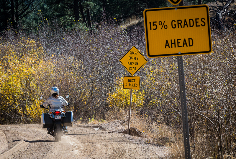 Overcoming Fear Riding BMW Motorcycle Steep Dirt Road Signs