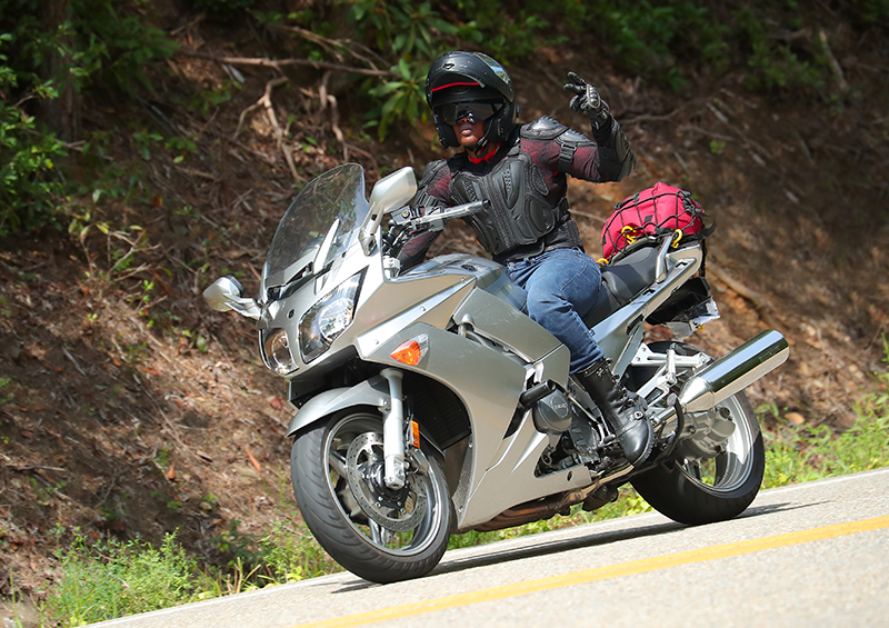 The Litas Greenville co-founder Kimba Reams women rider tail of the dragon peace sign