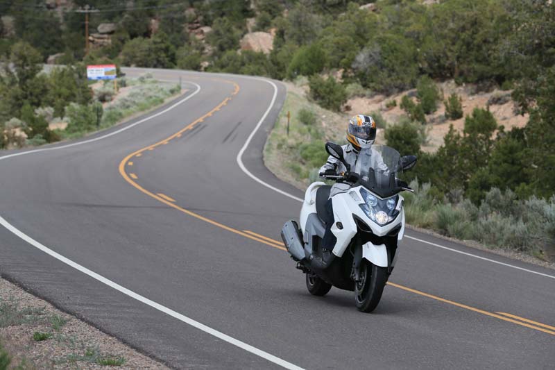 Scooter Review Kymco MyRoad 700i rider on curvy road 