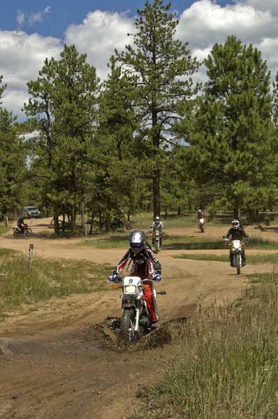 A Ride to Change Your Life riding through mud puddle