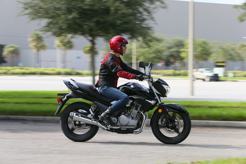 Motorcycle Review 2013 Suzuki GW250 woman riding 