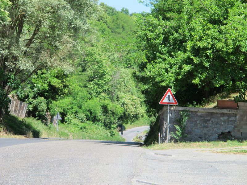 why you should ride a motorcycle in italy once in your life left turn sign