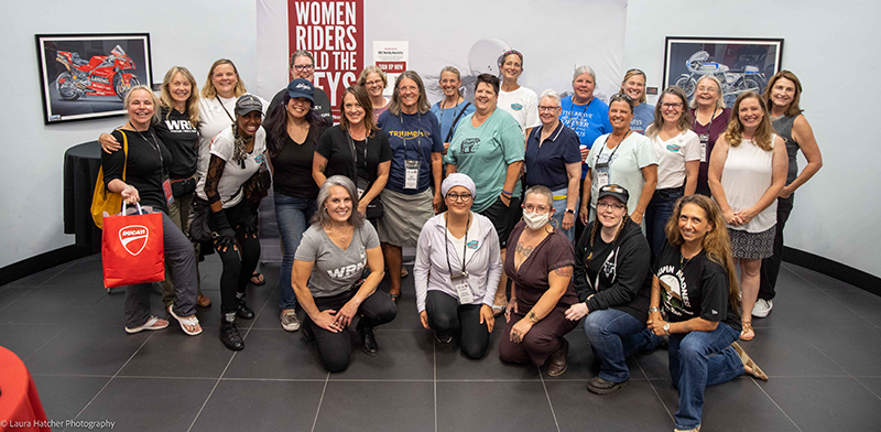 The lady riders meet with WomenRidersNow.com's (WRN) Sarah Schilke at the kickoff party in Portland, Oregon.