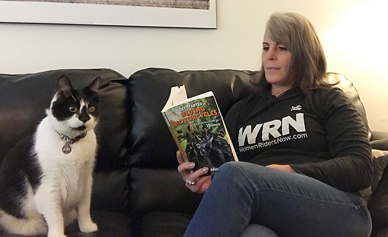 Sarah Schilke reading with Jojo the cat