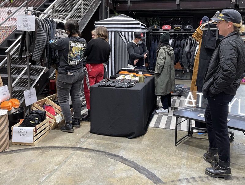 A great feature of the Moto Market is the ability for people to touch and feel the items available. Here Corinne Mayer of Atwyld enjoys watching shoppers inspect their great lineup of leather and textile gear offered at Sample Sale prices for the show.