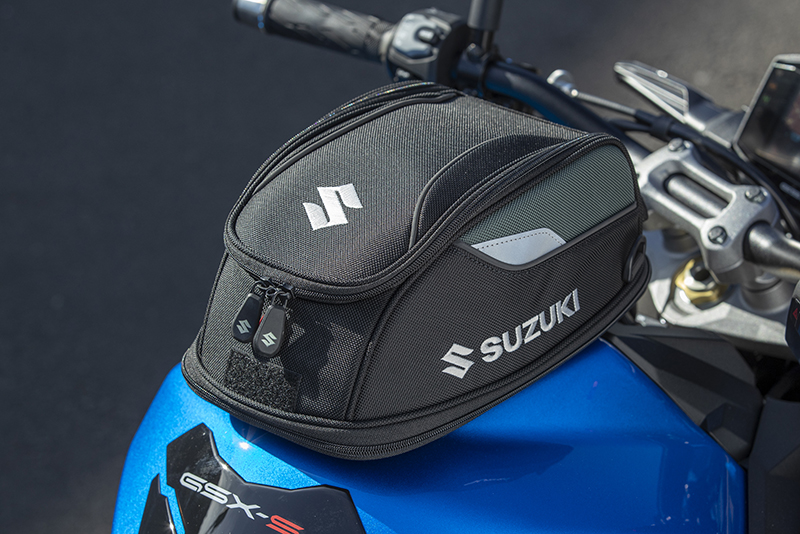 The Suzuki GSX-S1000 is truly a naked bike, so you’ll need to wear a backpack or mount a small tail or tank bag if you want to bring anything along. Two quick-release Suzuki tank bags are offered as optional accessories. This is the small Ring Lock Tank Bag, which costs $149.95.
