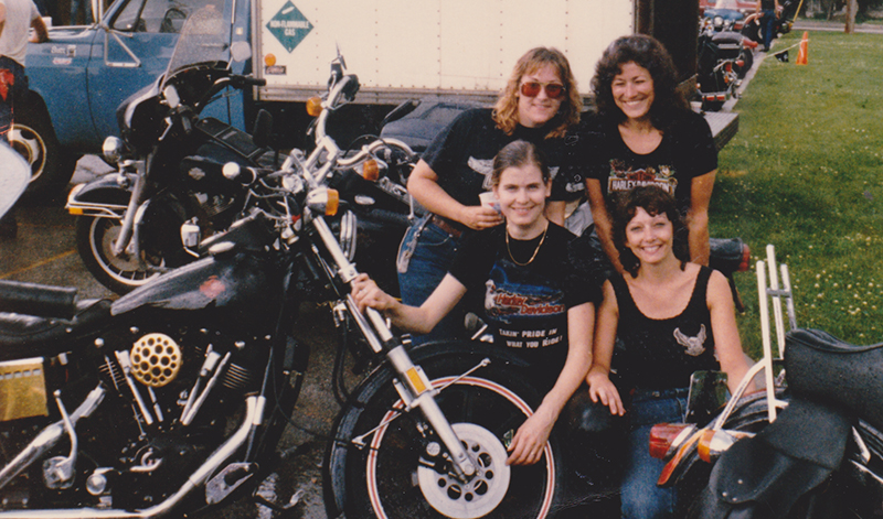 Deb “Boots” Wisniewski, Jo, Cam Stewart, and I at Open House Suburban Harley-Davidson in 1984.