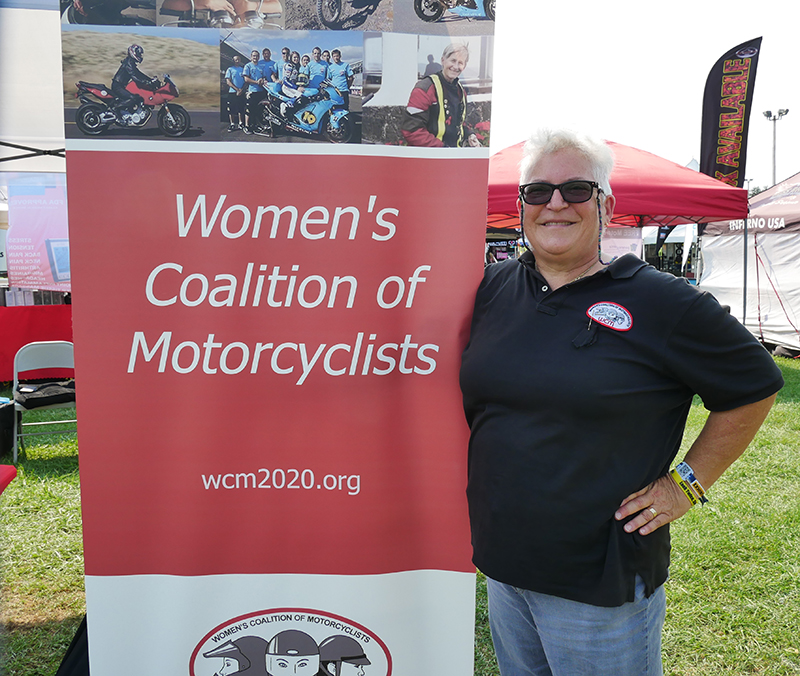 Lisa Malachowsky, a long-time advocate for women riders, represents the Women’s Coalition of Motorcyclists at a motorcycle rally.