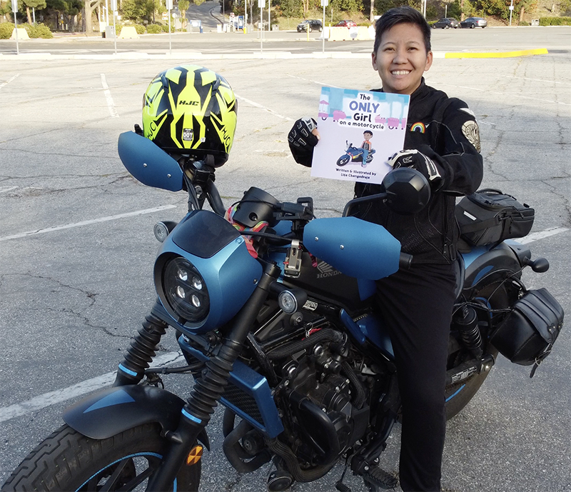 Author/Illustrator Lisa Changadveja with her book, <i>The Only Girl on a Motorcycle</i>