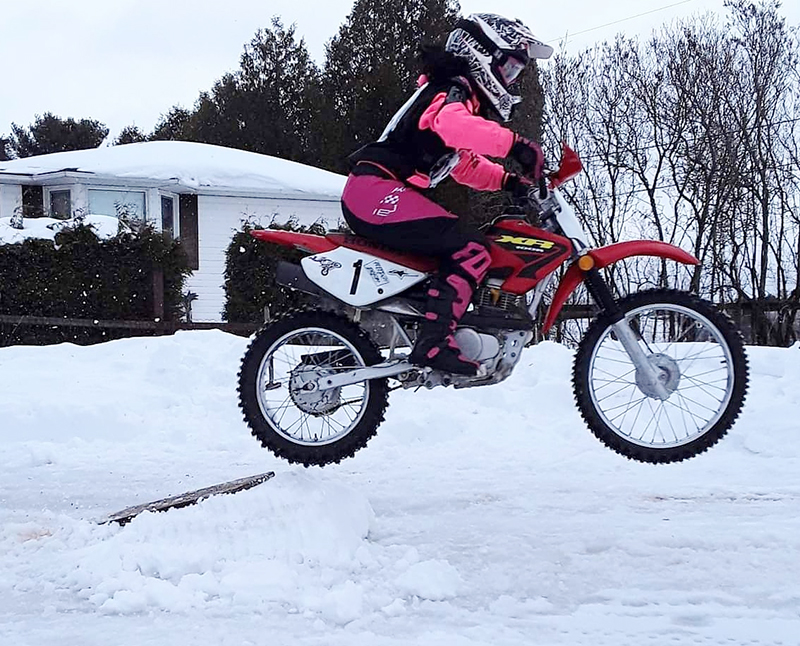 Jessica Rainville jumping in snow