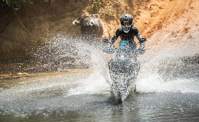 Erin Sills riding CFMOTO Ibex 450 Philipeans water crossing