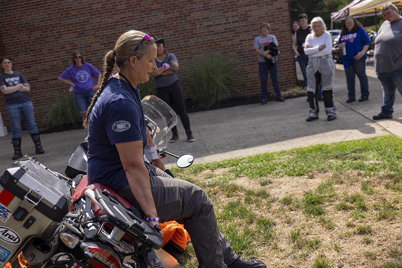 wendy crockett picking up a motorcycle