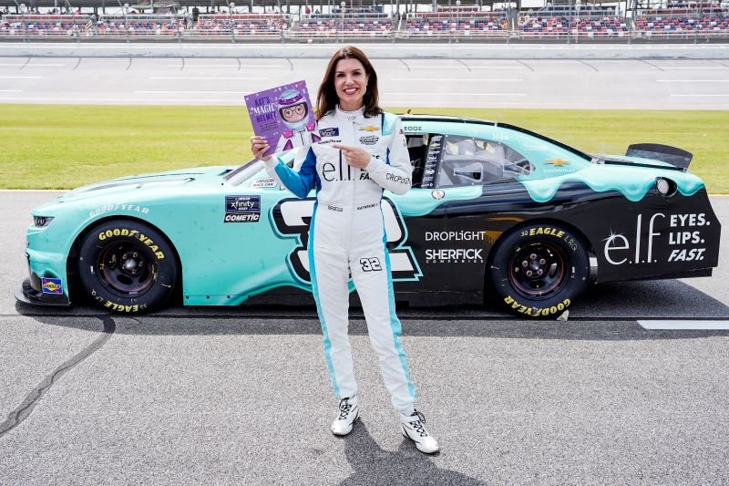 Katherine Legge with Kats Magic Helmet 1 Katherine Legge with the book Kat's Magic Helmet