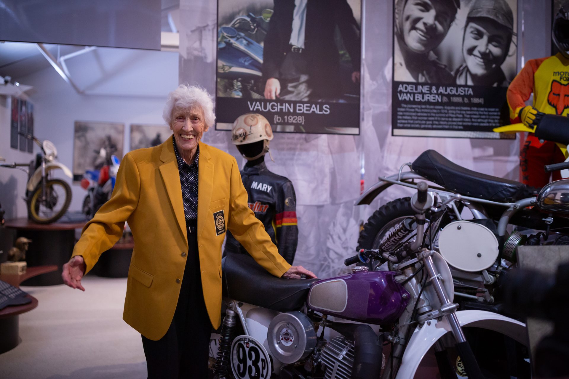 AMA_MaryMcGee_WillieBrowning Mary McGee poses with her race bike, sporting her AMA Hall of Fame jacket, in a final public appearance at the 2024 American Motorcyclist Association (AMA) Motorcycle Hall of Fame celebrations.