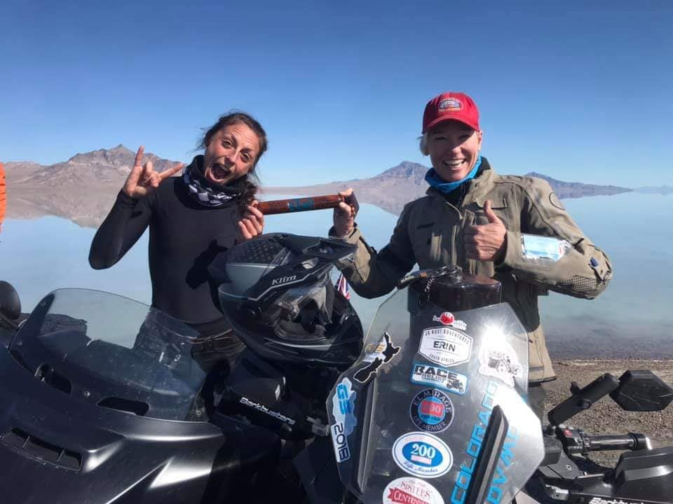 A historic handoff on hallowed ground—WRN co-owner and land speed record holder Erin Sills receives the WRWR baton from founder Hayley Bell at the legendary Utah Salt Flats. Wearing her iconic "red hat" as a member of the elite 200 MPH Club, Erin represents the fearless spirit and speed-driven sisterhood at the heart of women’s motorcycling.