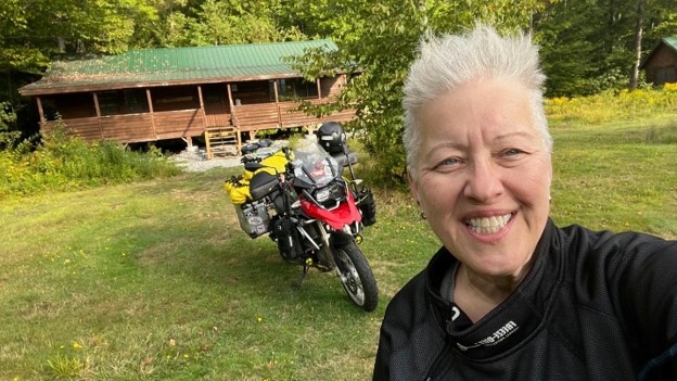 Picture1 Ruth Belcher arrives after completing her 3,900-mile Ride4Mary journey. My motorcycle also carried Mary McGee’s memory with me from the Pacific to the Atlantic—and became part of something bigger upon arriving here.