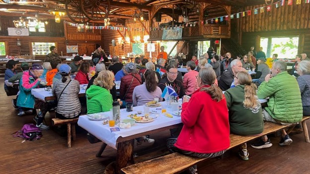 chow hall WIMA members and their partners gather for meals, camaraderie, and evening fun. WIMA-USA President Michelle Lamphere and her team poured heart and soul into organizing the event. Providing a joyful rhythm from start to finish. Thanks to the volunteers whose smiles were as constant as the rumble of bikes.