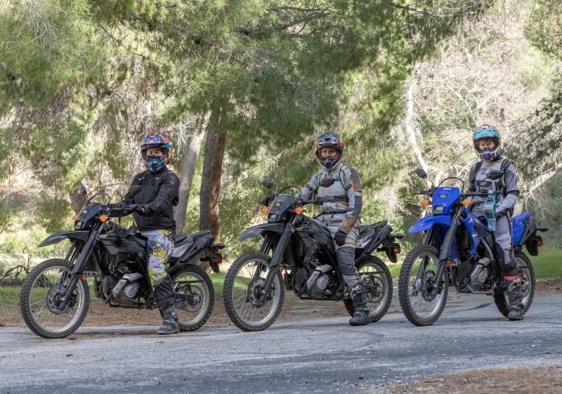 A group photo shows three different women riders on the Yamaha WR125R. In order from left to right I am the tallest at 6’1", the middle rider is 5’8”, and the shortest rider is 5’6”. We are all on the bike with its stock 34.4” seat.