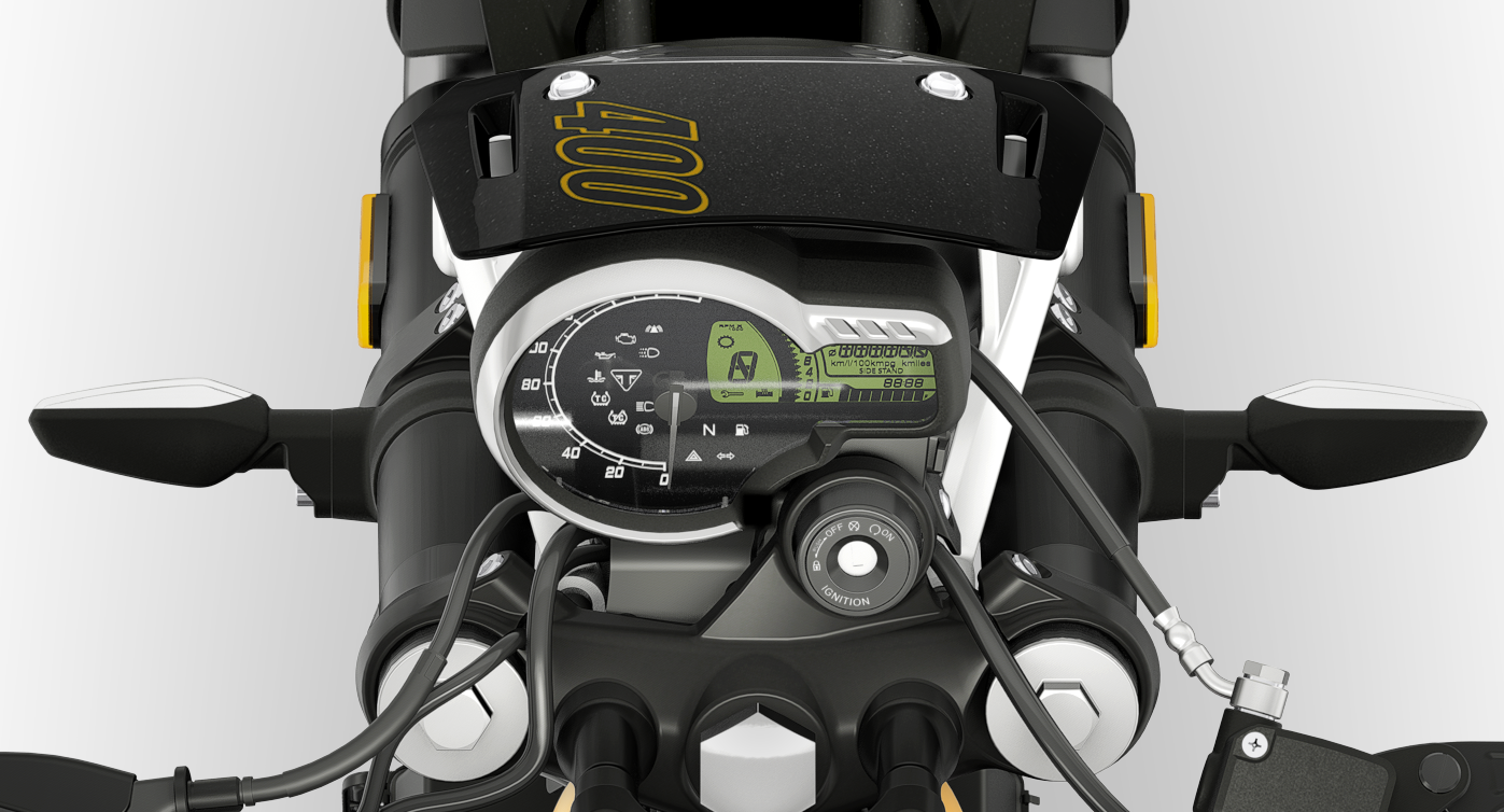 Instrumentation combines an analogue speedometer with a digital display. The look stays clean and classic while still providing plenty of information. A modern USB-C port is hidden on the back of the instruments.